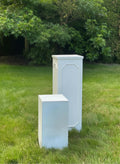 White concrete fibre pillars to display flower arrangements and candles on for wedding and events. Two sizes small and large.