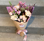 Lush hand-tied bouquet for Valentine's Day, featuring a selection of gorgeous, seasonally grown flowers and foliage, accentuated with ribbon.