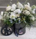 A boxed set of a large, lush bridal bouquet and matching boutonniere featuring white garden roses, ranunculus, delicate bridal spirea, stock, green-tinted eryngium, accented with wispy tree fern, seeded, and silver-dollar eucalyptus and mixed greenery.