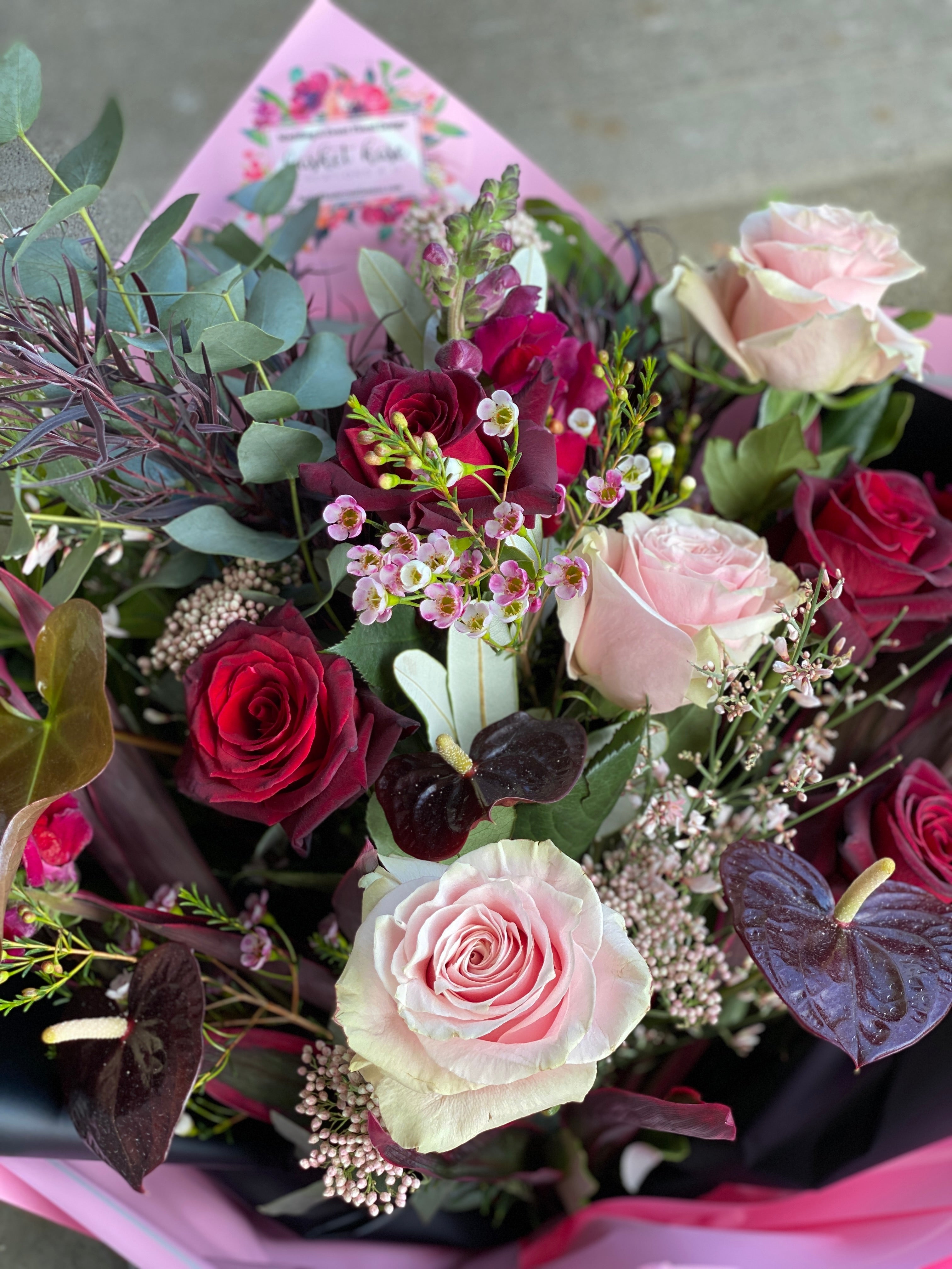 Lush hand-tied bouquet for Valentine's Day, featuring a selection of gorgeous, seasonally grown flowers and foliage, accentuated with ribbon.
